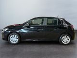 the black car is parked in a large room with a white wall