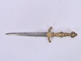 a small knife that is laying on a white surface