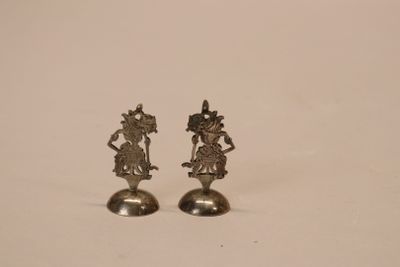 pair of silver plated figurines of a woman and a man