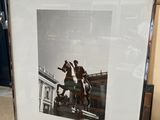 a picture of a man riding a horse in a picture frame
