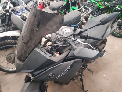 many motorcycles that are parked in a lot together