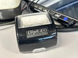 an image of a cell phone and a charger on a desk