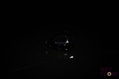 an image of a black diamond in the dark