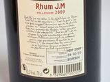 a bottle of rumm j m wine on the table