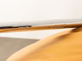 a close up of a metal object on a wooden table