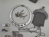 a lot of silver items that are on the table