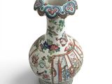a vase that is sitting on a white surface