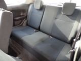 a seat in the back of a car that has two rows of seats
