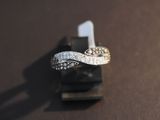 a ring that is sitting on top of a piece of wood