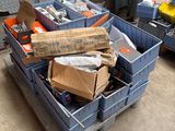 a pile of boxes sitting on a pallet in a garage