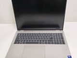 an open laptop computer sitting on top of a white table