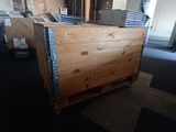 a wooden box that is sitting in the middle of a room