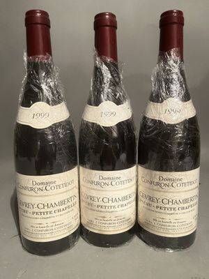 three bottles of wine sitting on top of a table next to each other