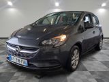 the grey opel is parked in a large room with checkered floor