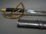 a silver and gold sword with a gold handle