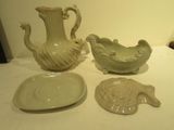 three pieces of pottery sitting on a table next to each other