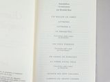 an open book with a picture of a cat on it