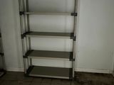 a metal shelving in the corner of a room