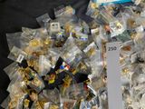 a pile of legos sitting on a table with a price tag in front of them
