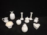 a lot of white objects that are on a black table