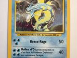 a close up of a pokemon card on a white surface