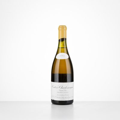 a bottle of white wine sitting on top of a table