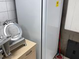 a white refrigerator in a kitchen next to a counter