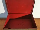 a red suitcase sitting on a table with its lid open