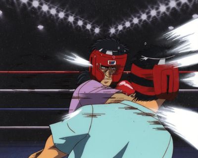 une image représentant un homme dans un ring de boxe, coiffé d'un casque rouge