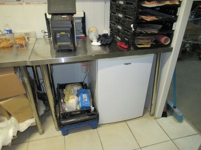 an image of a kitchen with a refrigerator and a dishwasher
