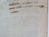 an old book with writing on it sitting on a table