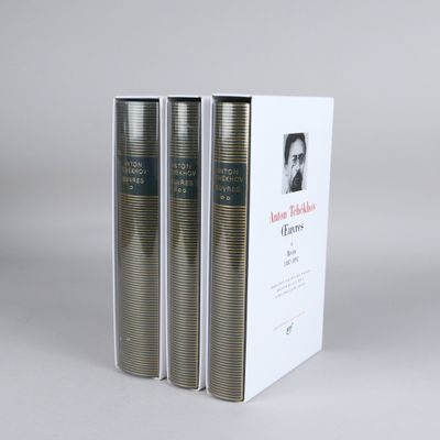 three books in a white box on a grey background