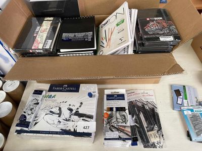 a box full of books and other items on a table