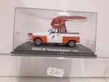 a model of an orange and white truck with a surfboard on top