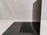 an open laptop computer sitting on top of a white table