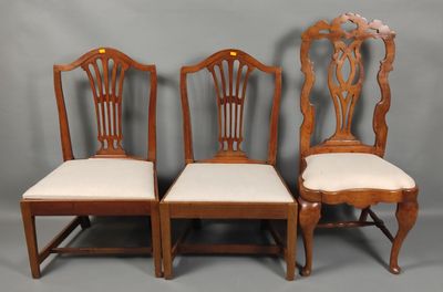 a set of four antique dining chairs with upholstered seats
