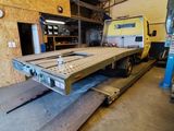 an image of a large flatbed truck in a building