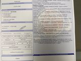a picture of a car registration form on a desk