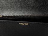 a black leather purse with a zipper on the inside