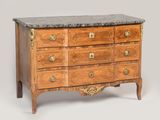 an antique chest of drawers with marble top and brass handles