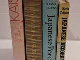 three books that are stacked on top of each other