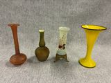 three vases sitting next to each other on a table
