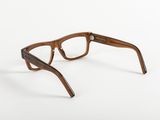 a close up of a pair of glasses on a white surface
