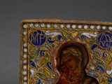 an image of a gold and enamel icon of the mother and child