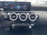 the dashboard of a car with a digital display in the center of it