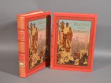 une paire de livres rouges sur lesquels figurent les images d'un homme et d'une femme