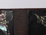 an old book with a picture of a bird on it