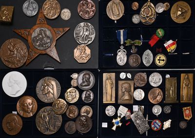 a lot of medals and medals on display in a case