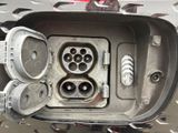 a close up of an electrical outlet in a car