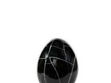 a black marble egg sitting on a black marble stand